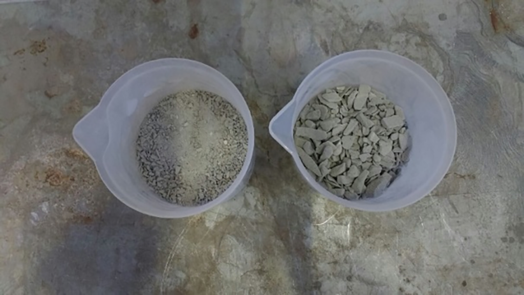 Granulated Foam Glass with different sizes in two plastic containers.
